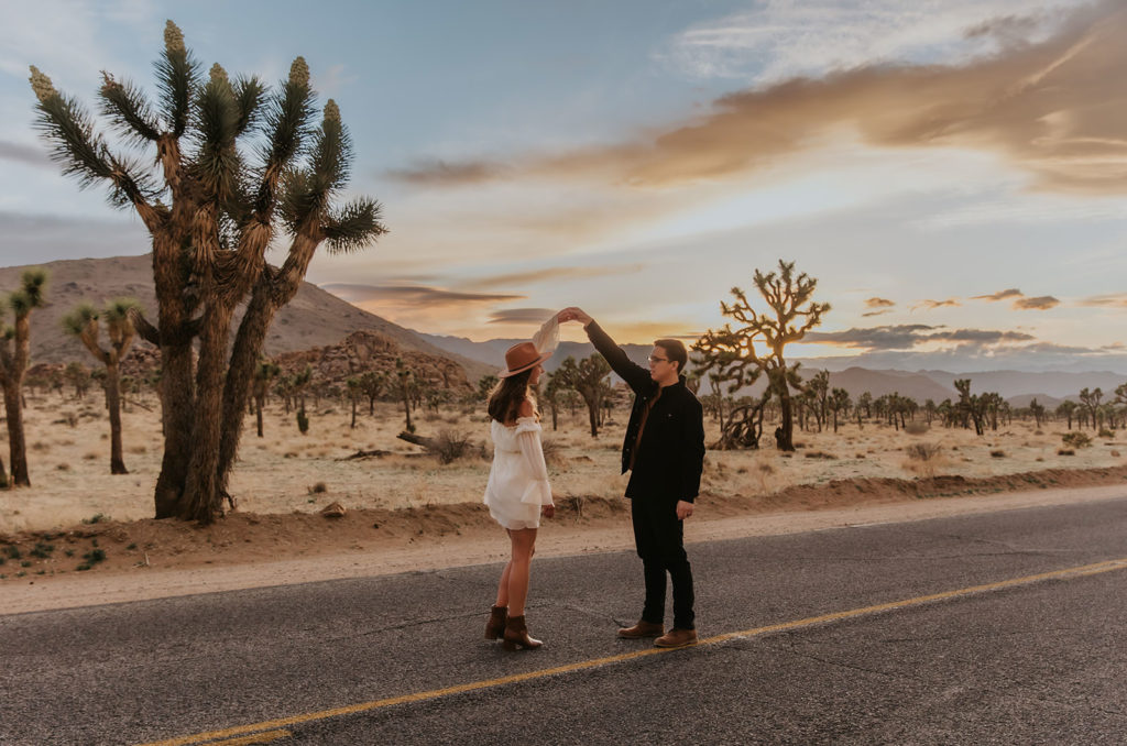 Couple during engagement photos during sunset in the street