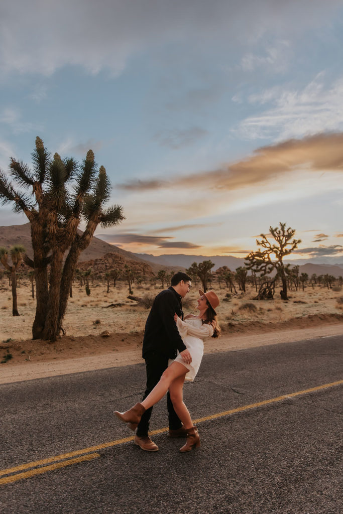 Couple during engagement photos during sunset in the street
