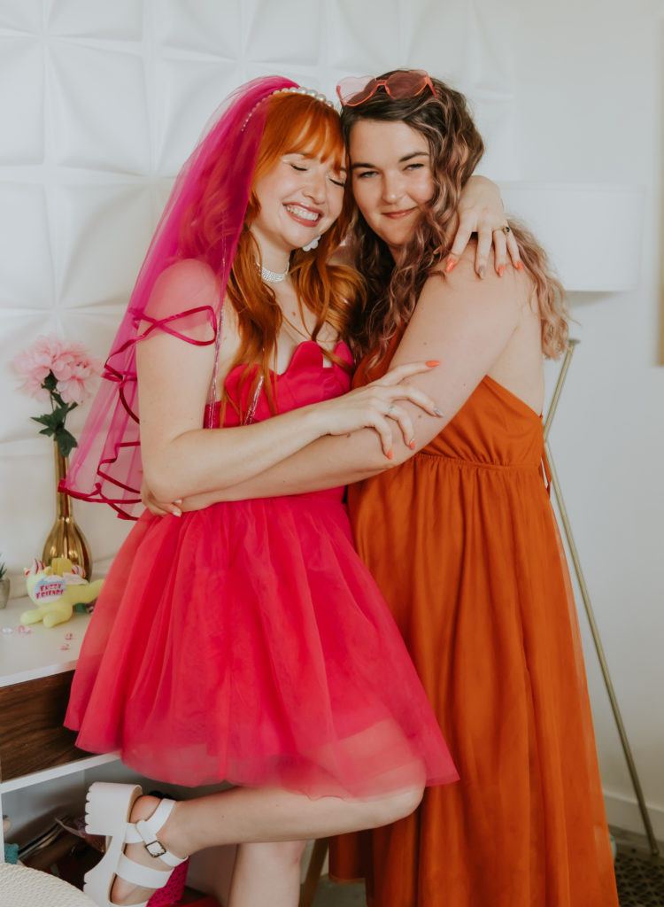 Bride and Friend hugging at her bachelorette party