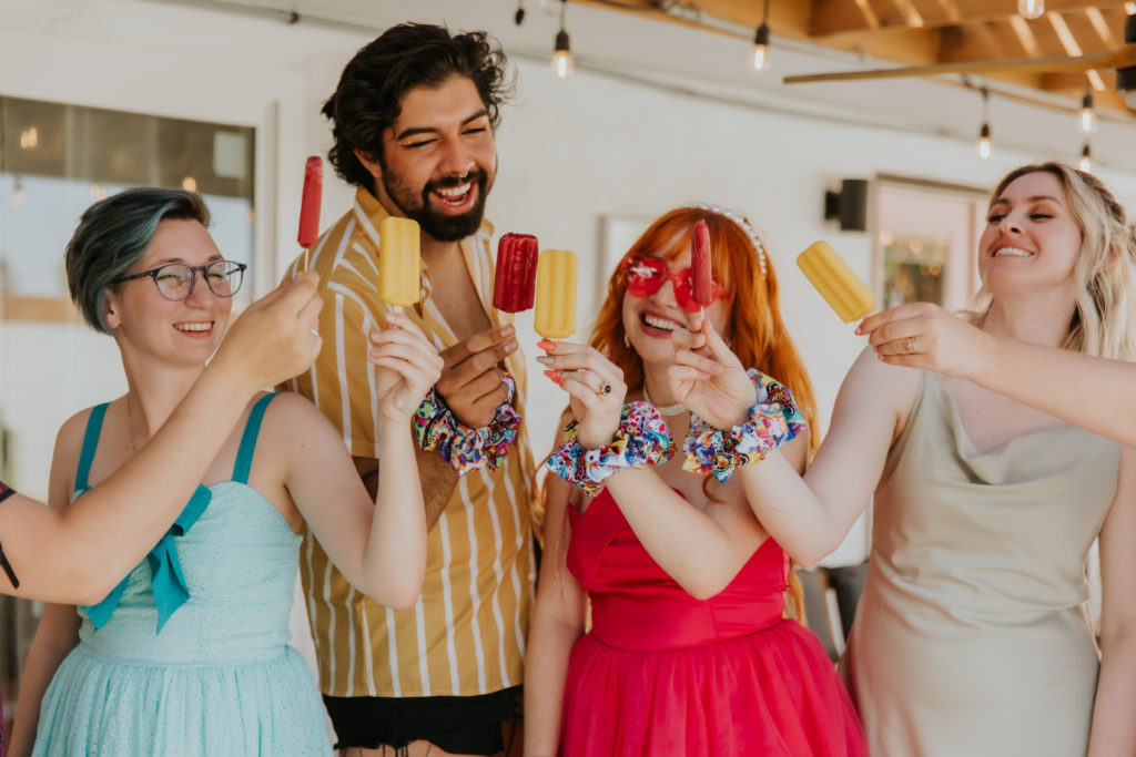 Bachelorette party eating colorful popsicles