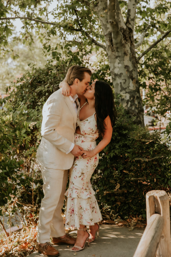 Bride and Groom kissing in the trees