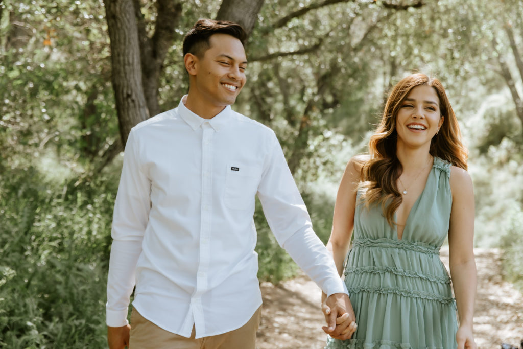 couple smiling and laughing during their engagement photos