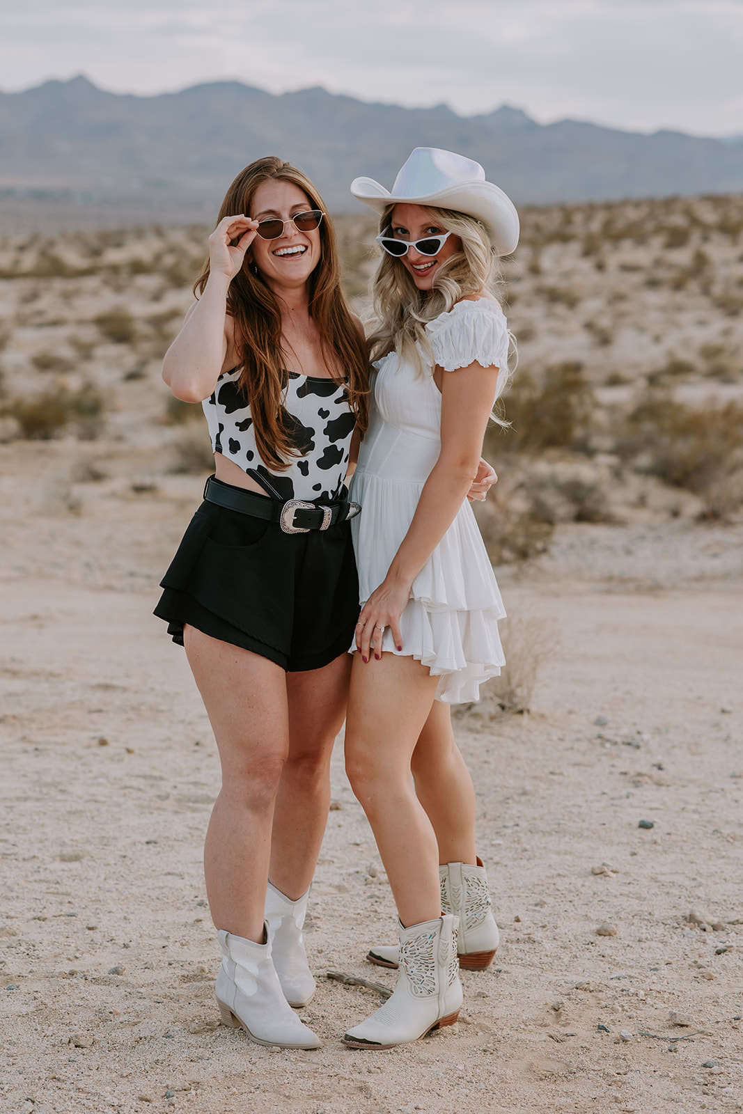 Bride posed with one of her bridesmaids in the desert during her bachelorette party