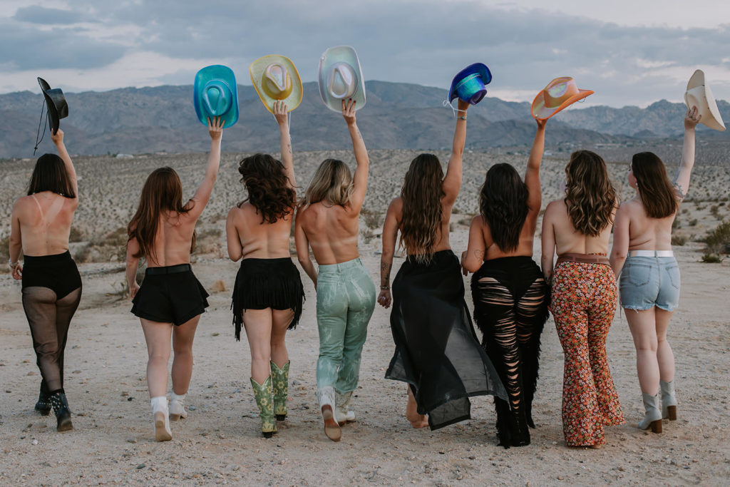 bachelorette party walking away from the camera in the desert
