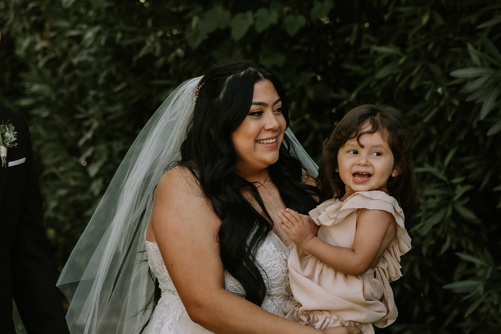 bride holding her daughter