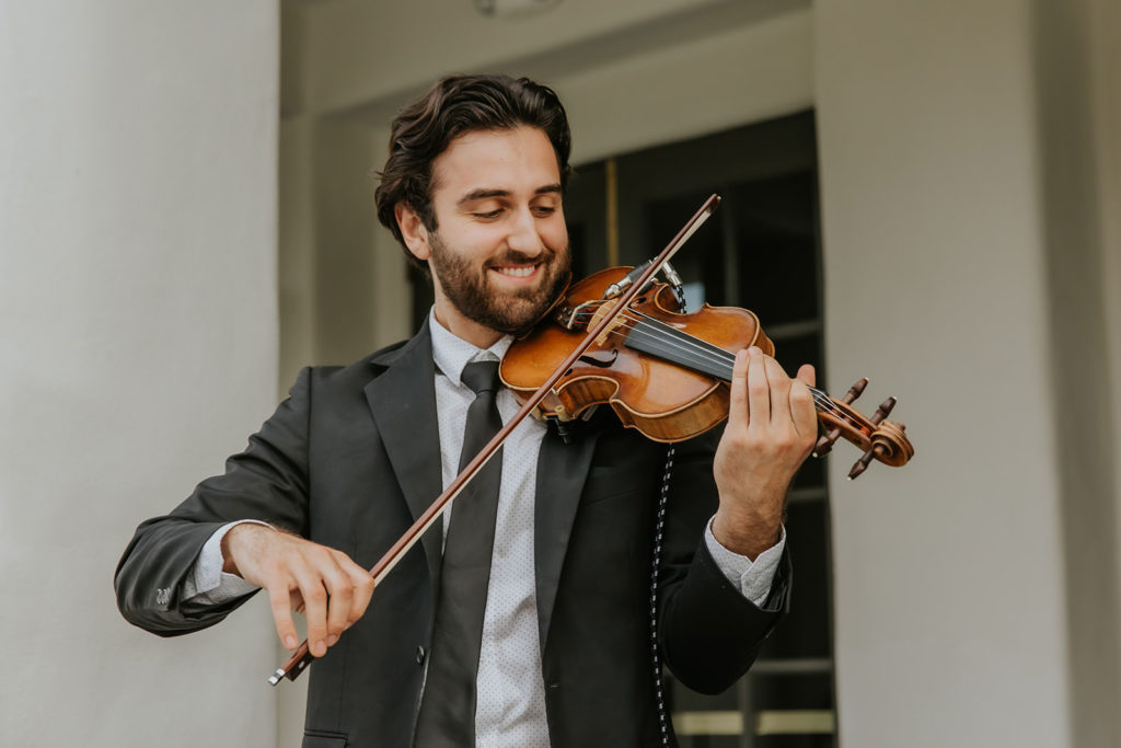 Violinist playing at a wedding at the marbella country club in san juan capistrano