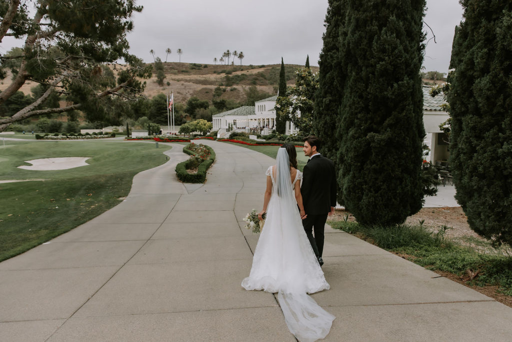 Bride and Groom walking the grounds of Marbella Country Club in San Juan Capistrano