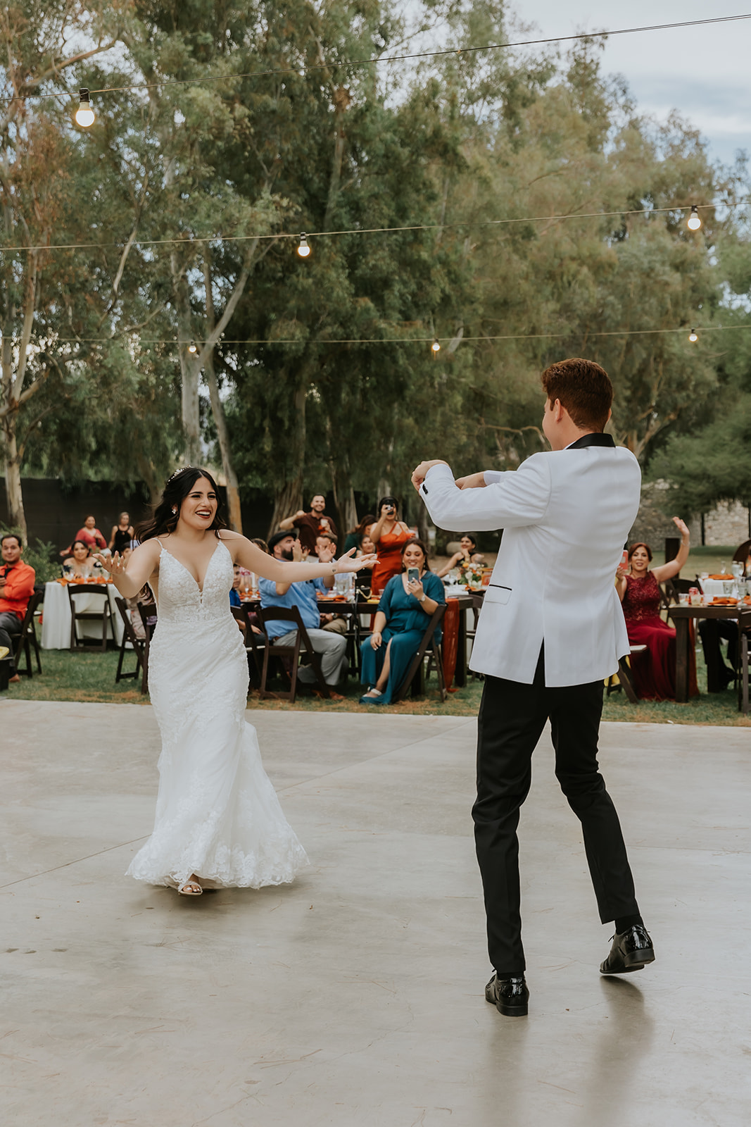 bride and groom dancing together at their themed wedding