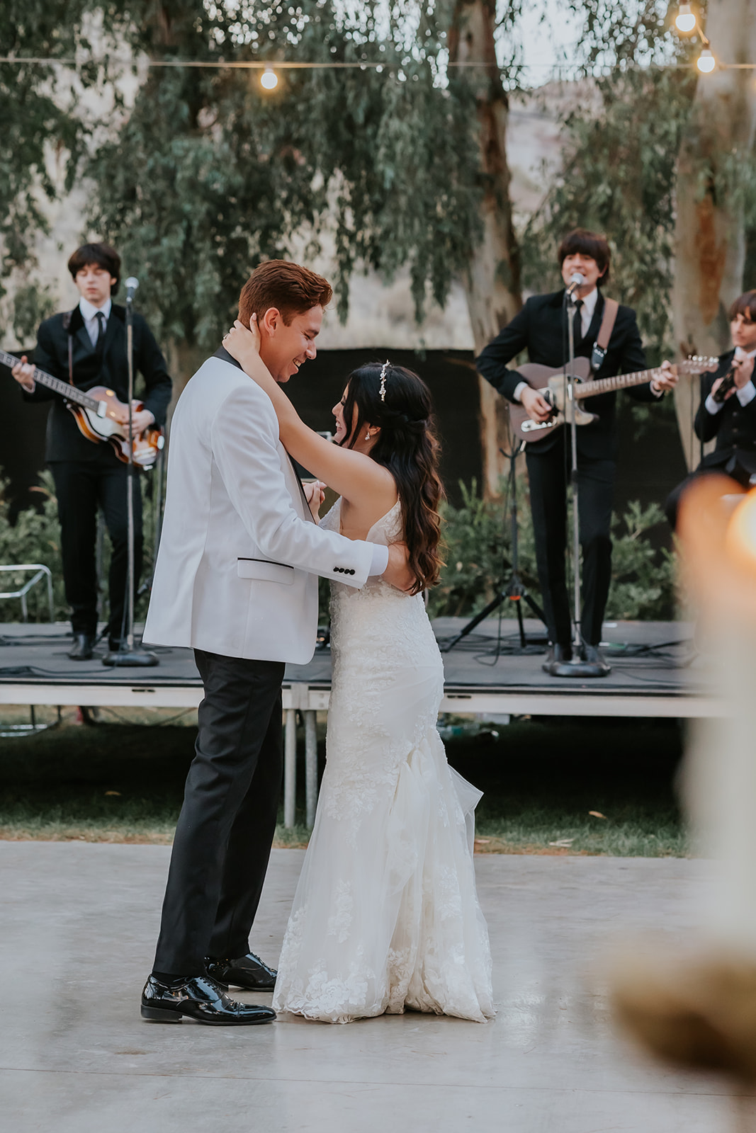 bride and groom slow dancing at their 70s themed wedding at Blomgren Ranch